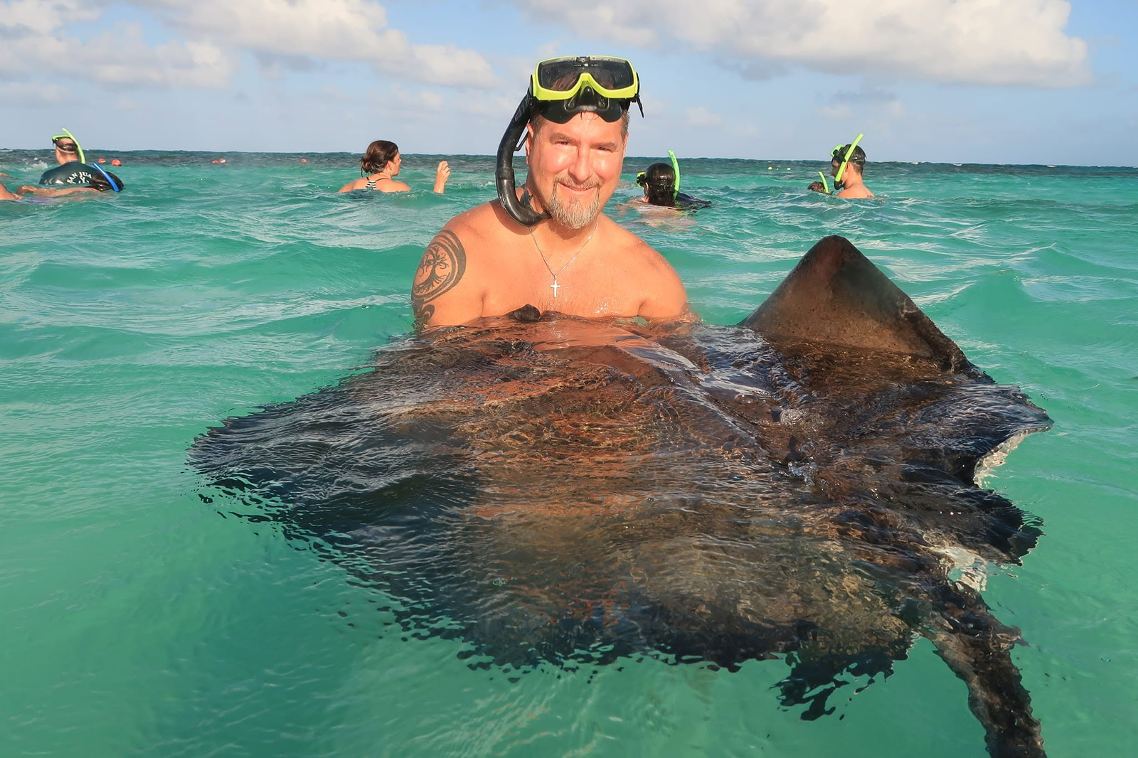 Lewis Szanyi IV snorkeling with a stingray